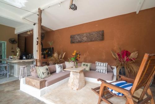 a living room with a couch and a table at Jellyfish2 2BR for Groups, 5 Min to Thomas Beach in Uluwatu