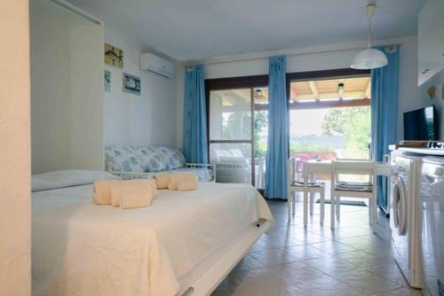 a bedroom with a bed with two pillows on it at Appartamenti sul mare in Santa Marinella