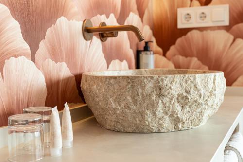 a bathroom with a marble sink on a counter at Hotel Internacional in Calella