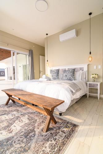 En eller flere senge i et værelse på Beachfront Villa