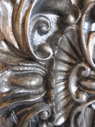 a close up of a metal object with a design on it at Druid House in Christchurch