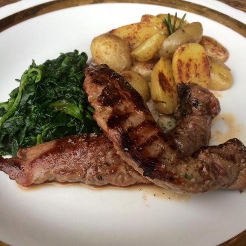 a plate of food with meat potatoes and broccoli at Penzion V polích in Malé Číčovice