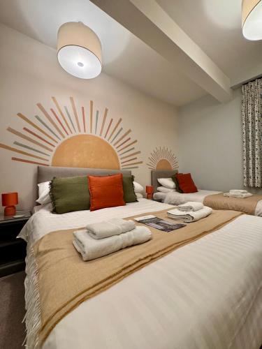 a bedroom with two beds with pillows on them at The Bar Convent Guest House in York