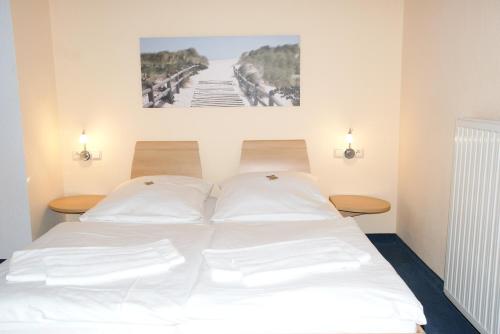 Ένα ή περισσότερα κρεβάτια σε δωμάτιο στο Residenz Seeblick
