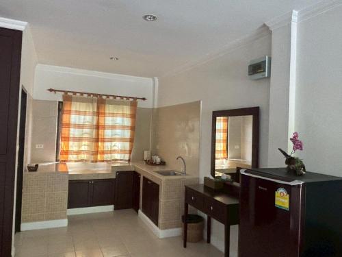 a large bathroom with a sink and a tub at Mireya Resort Khaoyai in Ban Khanong Phra Nua
