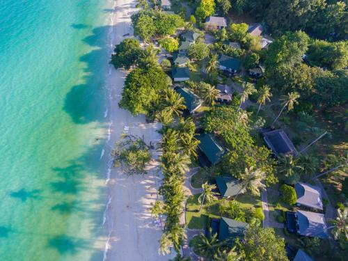 an aerial view of a beach with palm trees at Phi Phi Holiday Resort, Leam Tong Beach in Phi Phi Islands