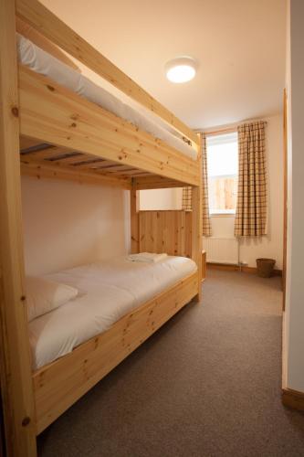 a bedroom with two bunk beds in a room at Black Isle Bar & Rooms in Inverness