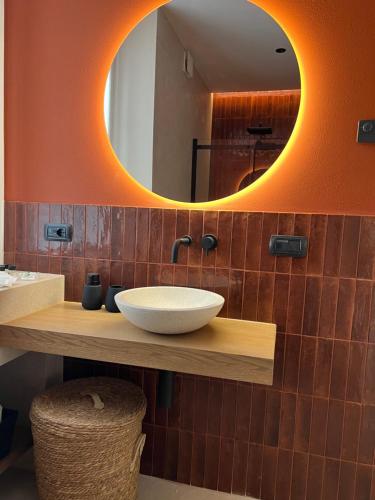 a bathroom with a sink and a mirror at Appartamento Nicole 20 in Menaggio
