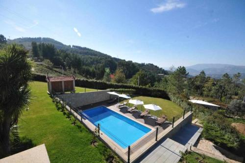 an aerial view of a villa with a swimming pool at Casa do Paraíso in Gemieira