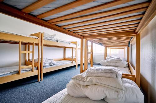 a room with four bunk beds in it at Fyrtårn Tommerup Hostel in Tommerup