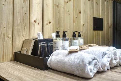 a shelf with towels and bottles on a table at RzepiskaView in Rzepiska
