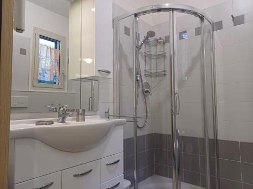 a bathroom with a sink and a shower at Casa Rita in Civezza