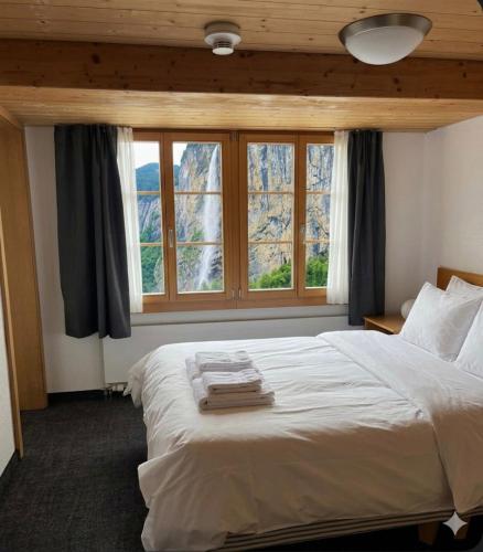 Postel nebo postele na pokoji v ubytování Chalet Rosa B&B