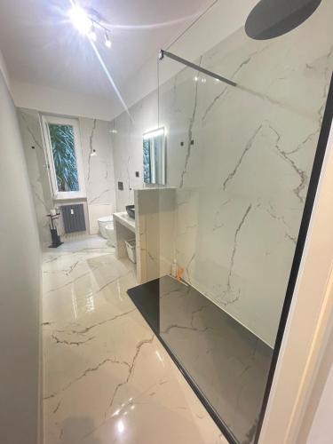 a bathroom with a marble counter and a sink at Casa Leone sea&terrace in Bogliasco