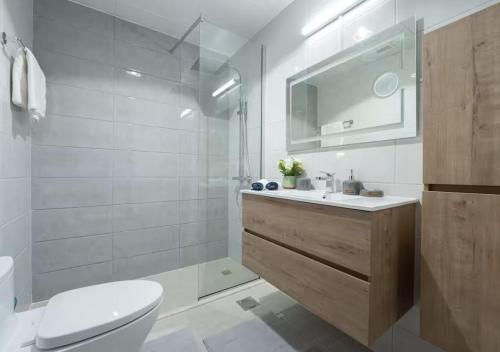 a bathroom with a toilet and a sink and a shower at Bohemian Rhapsody in Kuwait