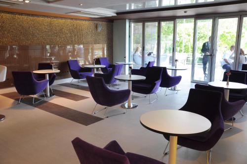 a conference room with tables and chairs and people at No 19 Boutique Hotel in Ankara