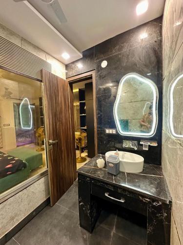 a bathroom with a sink and a mirror at Nagpal Farm in Panchkula