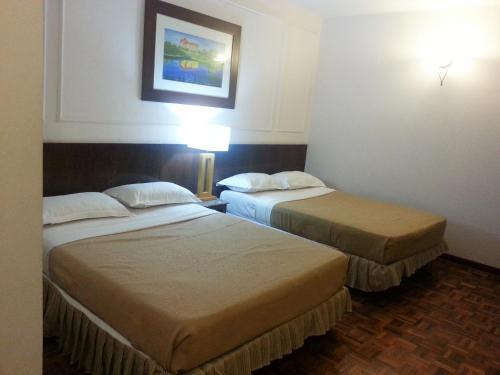 Tempat tidur dalam kamar di A Famosa Resort Melaka