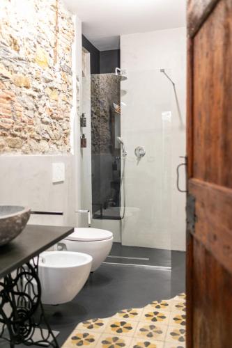 a bathroom with a white toilet and a shower at Trilocale Luxury - 5 minuti Acquario di Genova in Genoa