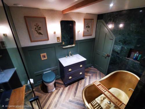a bathroom with a sink and a shower at The Architects Home in Stow on the Wold