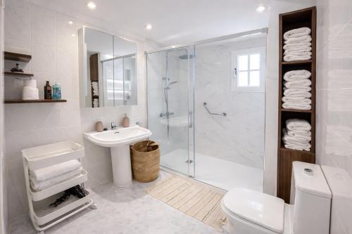 a bathroom with a shower and a toilet and a sink at Sunny Playa del Cura in Playa del Cura