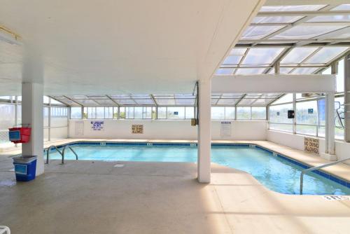a large swimming pool with a glass ceiling at Direct Oceanfront Magic at Sea Marsh w Pool in Myrtle Beach