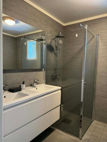 a bathroom with a sink and a shower at Trysil Central Villa in Trysil
