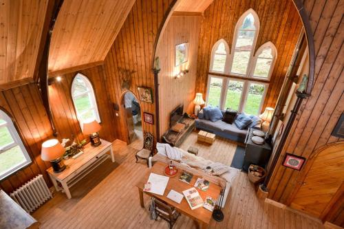 an overhead view of a living room in a house at The Tabernacle, Design-led Converted Chapel with Hot Tub, Highland Perthshire in Aberfeldy