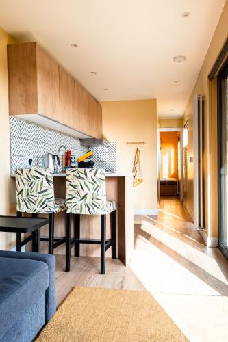 a kitchen with a table and a counter top at Square 32 Luxury Shipping container in Knockcloghrim