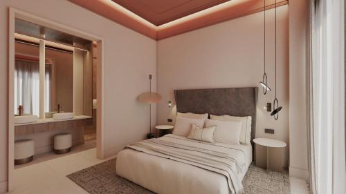 a bedroom with a large bed and a bathroom at Fahana Triana 54 Adults Only in Las Palmas de Gran Canaria