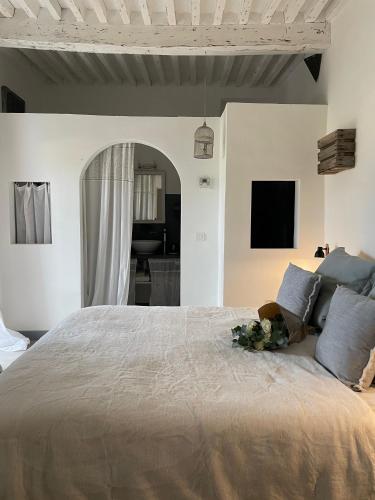 a bedroom with a large bed with a flower on it at Domaine La Parpaille in Cucuron
