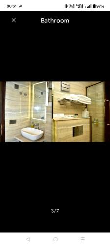 a bathroom with a sink and a mirror at HotAlnovaiN in Agra