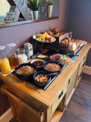 a buffet with many different types of food on it at Colcombe Castle Hotel in Colyton