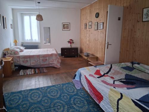 Llit o llits en una habitació de La maison du Thoré