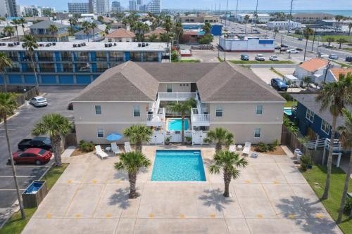 an aerial view of a house with a swimming pool at Los Cabos I #5 condo in South Padre Island