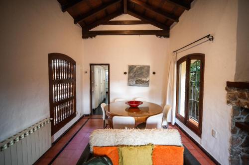 a dining room with a table and chairs at Casona Don Roque in Salta