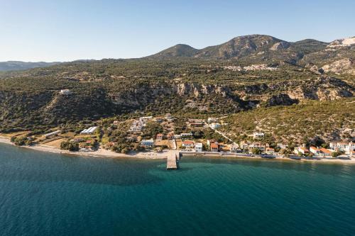 an aerial view of a small island in the water at Villa Alexia - Private Pool & Panoramic Sea Views in Órmos Koumaíïkon