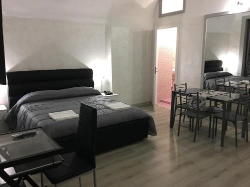 Ένα ή περισσότερα κρεβάτια σε δωμάτιο στο B&B Etnea Palace