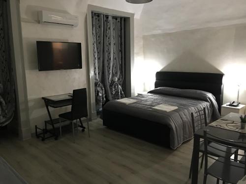 Ένα ή περισσότερα κρεβάτια σε δωμάτιο στο B&B Etnea Palace