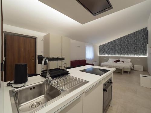 a kitchen with a sink and a counter top at Palombarone Resort in Matelica
