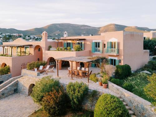 an image of a house with a patio at Beachfront Majestic Villa in Liaropá