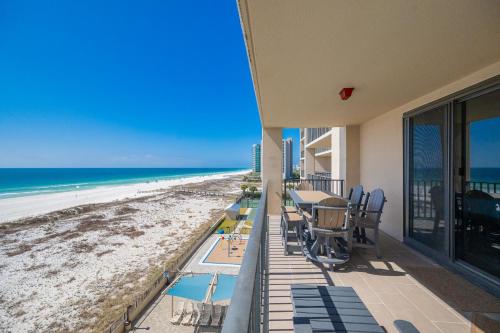 a balcony with a view of the beach at Phoenix X 506 condo in Orange Beach