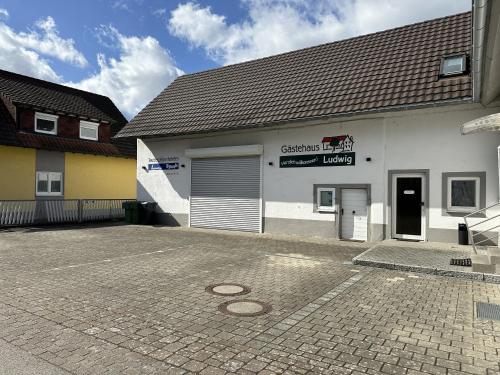 a parking lot in front of a building at Gästehaus Ludwig in Rust