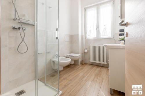 a bathroom with a shower and a toilet and a sink at CASA MIA by Design Studio in Colico