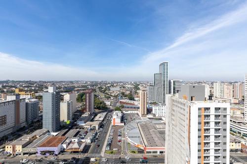 a view of a city with a street and buildings at Ibiza 2410 · Vista incrível: Piscina, Academia e Bem Localizado in Curitiba