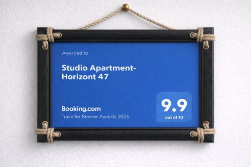 a sign for a studio apartment horrothorn at Studio Apartment-Horizont 47 in Novi Sad