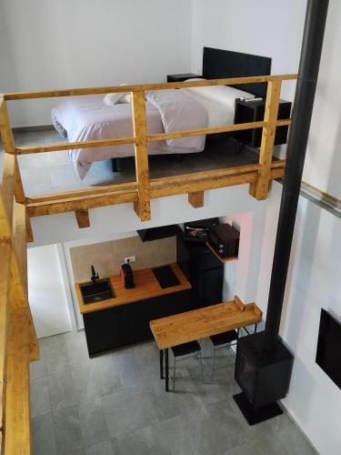 a room with a bunk bed and a table at Apartamento Catalina in Algodonales