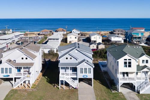 an aerial view of a row of houses near the ocean at 4749 - Salty Dawgs in Kitty Hawk Beach