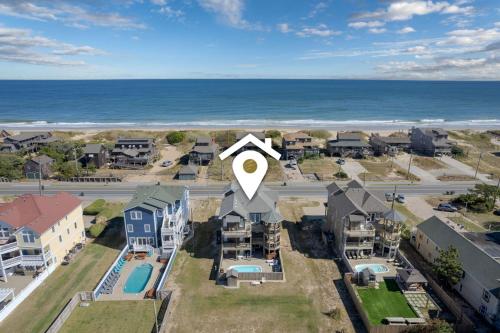 an aerial view of a house with a satellite at 5469 - Below Deck OBX in Nags Head