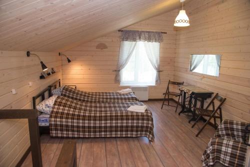 Postel nebo postele na pokoji v ubytování Guest House U Pruda